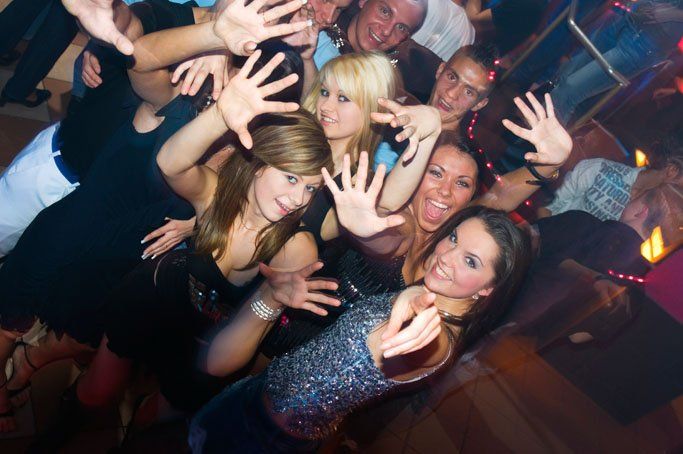 Nightclub security team monitoring a busy dance floor